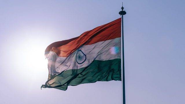 Rupee defies regional weakness to rise against dollar